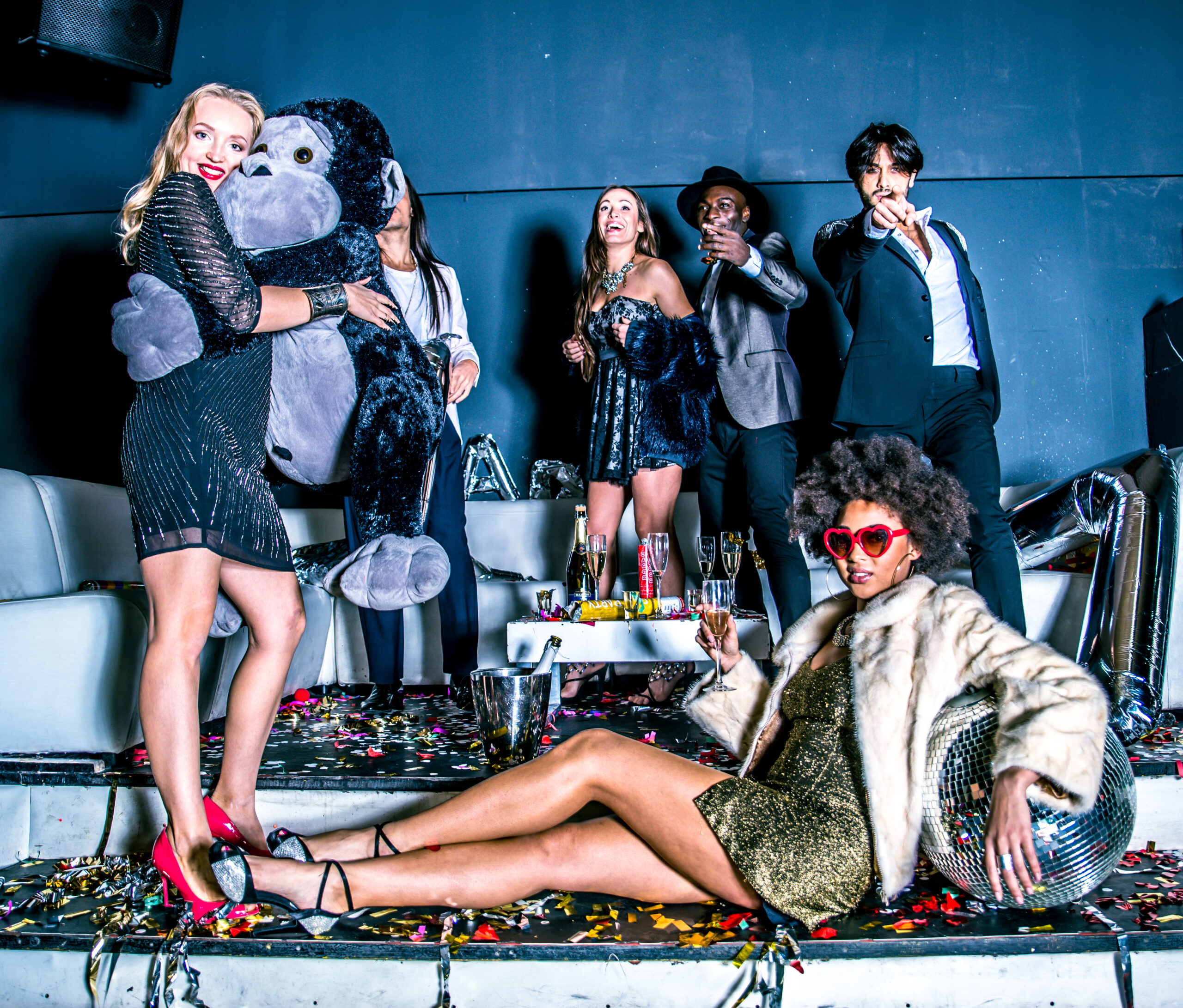 Multi-ethnic group of friends celebrating in a nightclub - Clubbers having party